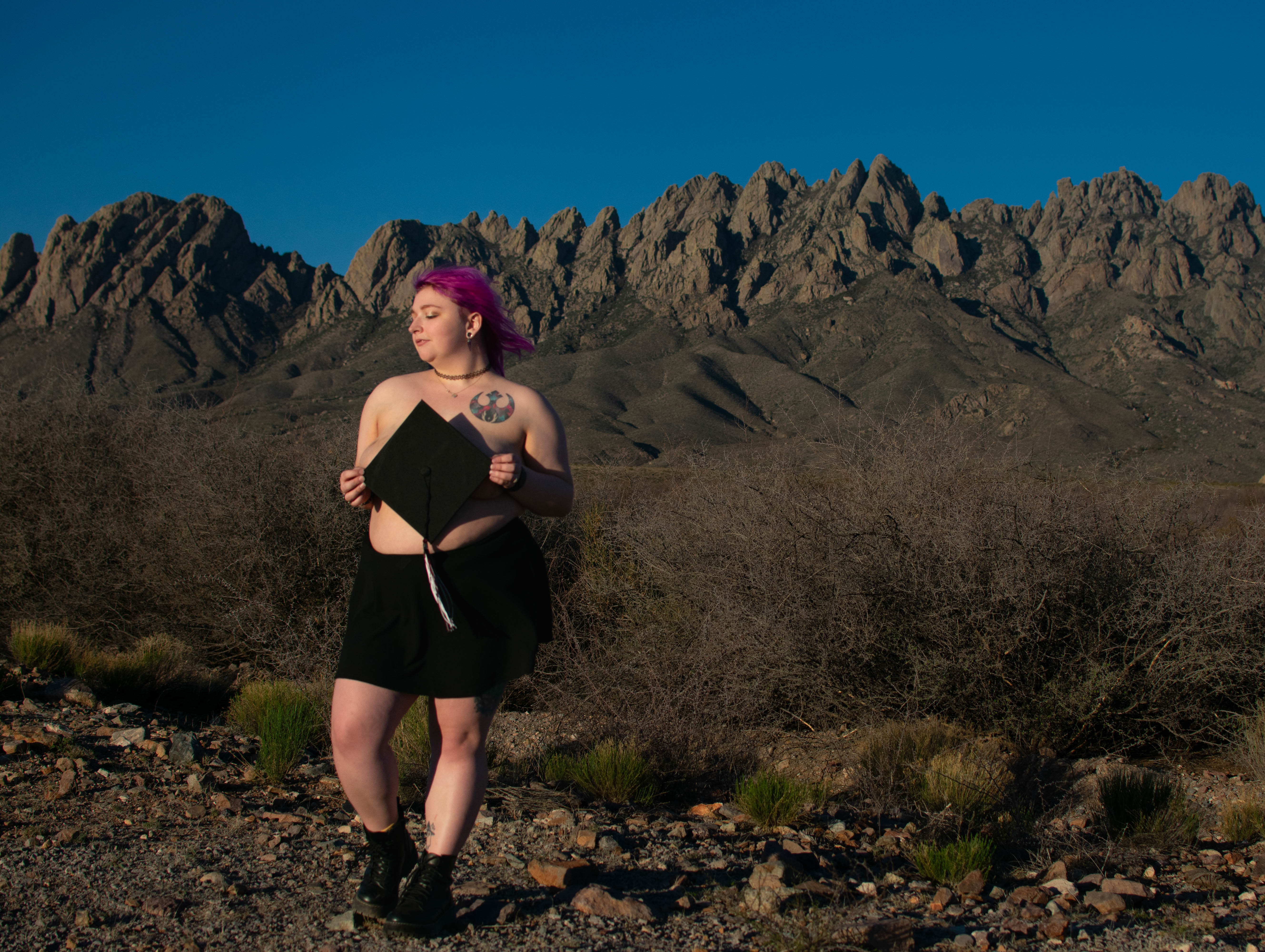 Outdoor boudoir as a graduation celebration in Las Cruces, NM with the Organ Mountains. 
